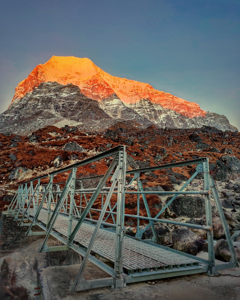 Mountain peak illuminated by sunset